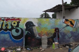 Anas is watching’, mural by Nico Wayo. Accra, Ghana. Photo: K. Gurney