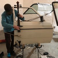 Shane Cooper playing a prepared and sculpted car door (made and conceived as a sound-installation work by artist Gerhard Marx)
